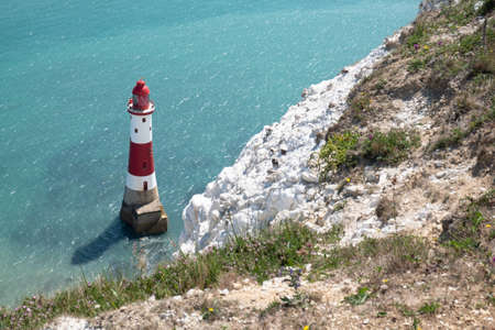 Lighthouse in the sea, Beachy Head, England