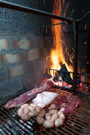 Closeup of meat cooking. The barbeque, or asado a la parilla is a typical Argentinian way of cookingの写真素材