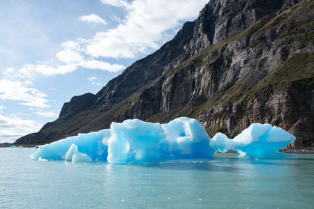 Large pieces of intense blue ice drifting in the lakes of Los Glaciares National Park. Most famous attraction here is the Perito Moreno glacierの写真素材