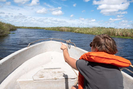 Colonia Carlos Pellegrini, Argentina - October 2018: Bird spotting from a boat at Ibera Wetlands, national park, Corrientes Province, Argentinaのeditorial素材