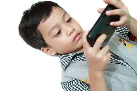 Kid Playing Game At The Handphone Seriouslyの写真素材