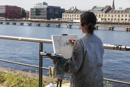 Painter on the River Spree in Berlin Treptowのeditorial素材