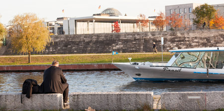 Man sits on the River Spree in Berlin Mitteのeditorial素材