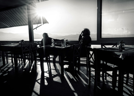 two seniors in a Greek barの写真素材