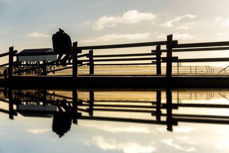 Lovers on the beach at sunsetの写真素材
