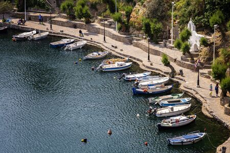 fishing boats in a small harborの写真素材