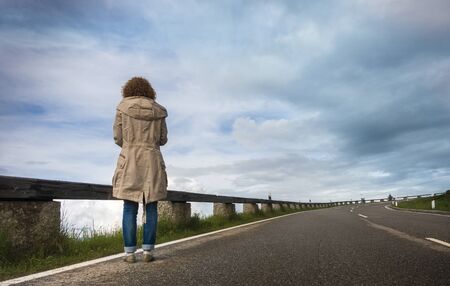 Woman waiting on the road