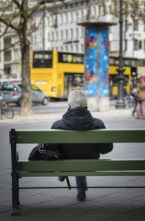 Senior waiting in berlinの写真素材