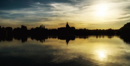 Evening sun at the lakeの写真素材