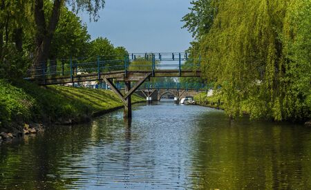 Water canal in Friedrichstadt in Schleswig Holsteinの写真素材