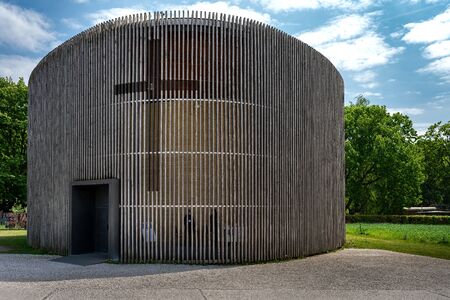 Oval church with wood facade at the Berlin Wall Memorial