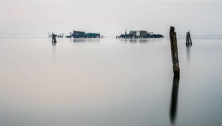 Fishing huts in the sea near Veniceの写真素材