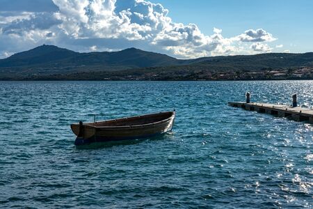 Wooden boat in the waterの写真素材