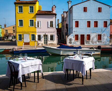 Covered tables on the island of Burano near Veniceの写真素材