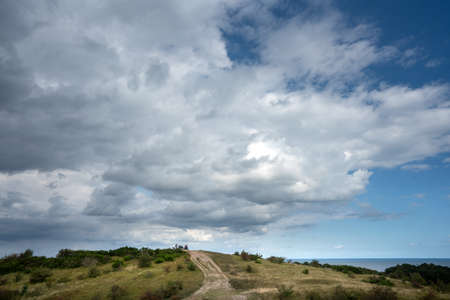 Rain clouds, dunes and the beach on the Baltic Sea island of Hiddensee near RÃ¼genの写真素材