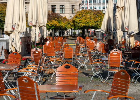 Empty tables and chairs in an outdoor restaurant in Berlinのeditorial素材