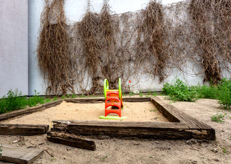 Desolate children's playground behind a newly built condominium in downtown Berlinの写真素材