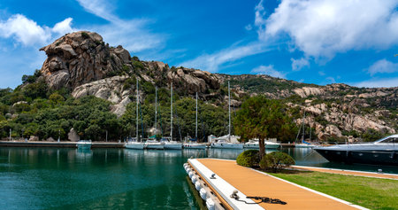 sailboats and yachts in a small port on the island of sardiniaのeditorial素材