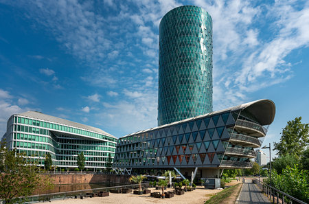 the westahfentower in frankfurt with the main river and a boat for tours in the foregroundのeditorial素材