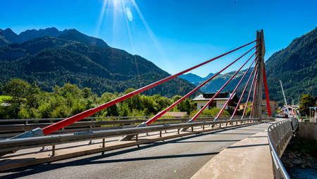 a bridge over the river Lech in the beautiful landscape of tyrolの写真素材