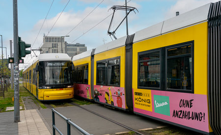 yellow trams at Alexanderplatz and in the cityscape of Berlinのeditorial素材