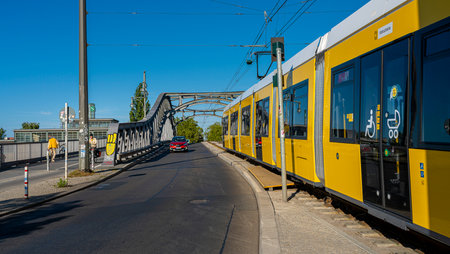 yellow trams at Alexanderplatz and in the cityscape of Berlinのeditorial素材