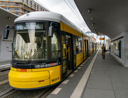 yellow trams at Alexanderplatz and in the cityscape of Berlinのeditorial素材