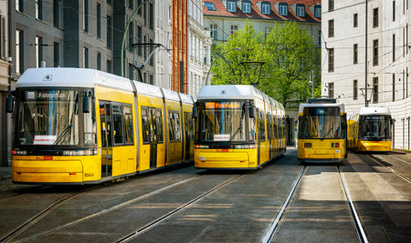 yellow trams at Alexanderplatz and in the cityscape of Berlinのeditorial素材