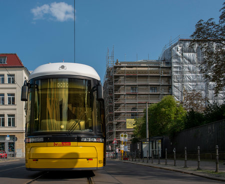 yellow trams at Alexanderplatz and in the cityscape of Berlinのeditorial素材