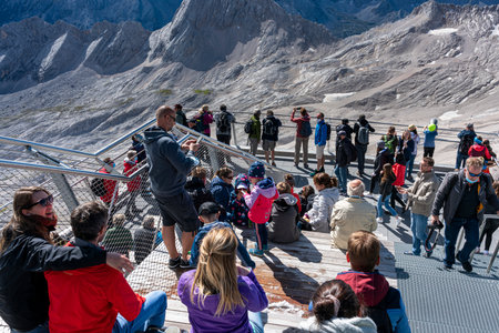 Viewing platform with tourists on the Zugspitze with a view of the Eibsee and AllgÃ¤u, Bavaria, Germany, Europeのeditorial素材