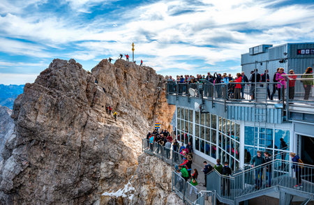 Viewing platform with tourists on the Zugspitze with a view of the Eibsee and AllgÃ¤u, Bavaria, Germany, Europeのeditorial素材