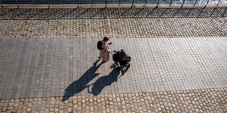 Mother with a stroller on the banks of the Spree in Berlinのeditorial素材