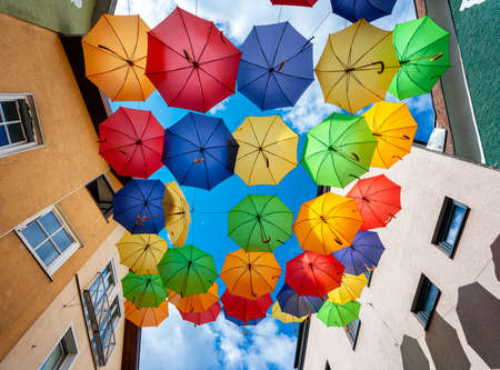 colorful umbrellas against a blue skyの写真素材