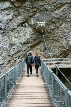 young couple on the way to the Rosengartenschlucht in Imst, Tyrolの写真素材