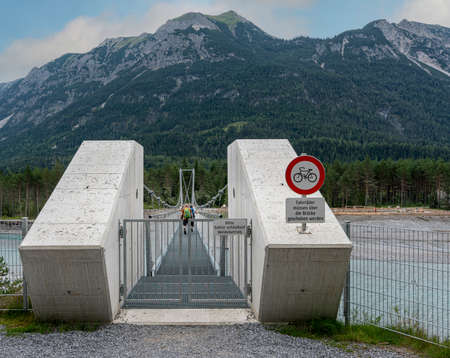 Suspension bridge over the Lech near Reutte, Tyrolの写真素材