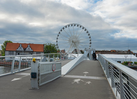 Pedestrian bridge with Ferris wheel in Gdansk, Polandのeditorial素材