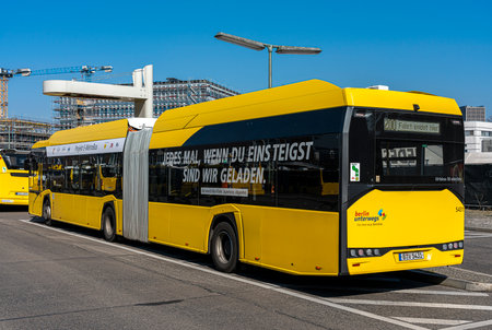 E-Metro bus at the charging station at the Zoologischer Garten bus station on Hertzstrasseのeditorial素材
