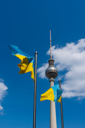 The Ukrainian national flag in front of the Berlin TV tower at Alexanderplatzのeditorial素材