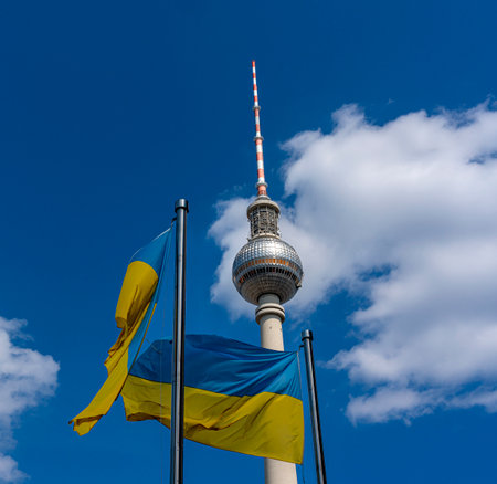 The Ukrainian national flag in front of the Berlin TV tower at Alexanderplatzのeditorial素材