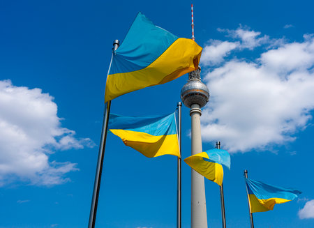 The Ukrainian national flag in front of the Berlin TV tower at Alexanderplatzのeditorial素材