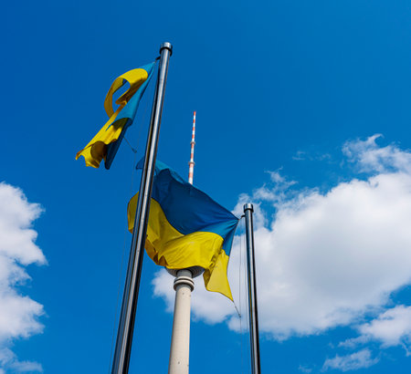 The Ukrainian national flag in front of the Berlin TV tower at Alexanderplatzのeditorial素材