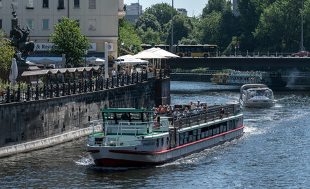 Steamboat ride in the summer midday heat, Spree at Nikolaiviertel, Berlinのeditorial素材