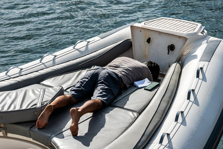 Inflatable boat, craftsman at repair, Lanzarote, Canary Islands, Spainのeditorial素材