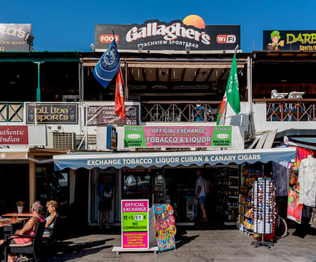 Shops and restaurants on the seafront promenade, Avenida de las Playas, Puerto del Carmen, Lanzarote, Canary Islands, Spainのeditorial素材