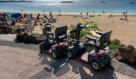 motorized wheelchair, Playa Dorada, Lanzarote, Canary Islands, Spainのeditorial素材