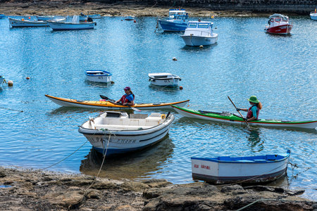 Paddle boats in the Charco de San Gines Lagoon, fishing boats, Arrecife, Lanzarote, Canary Islands, Spainのeditorial素材