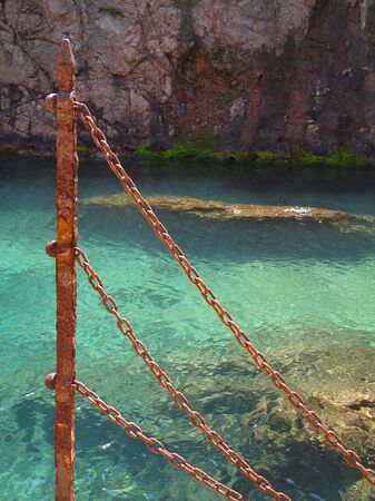 Rusty chain fence -coastalの写真素材