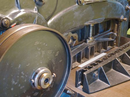 Old printing press with cogs, bars, wheels and leversの写真素材