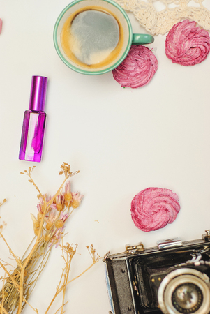 flat lay- desk with coffee, zephyr, laptop and cosmeticsの写真素材