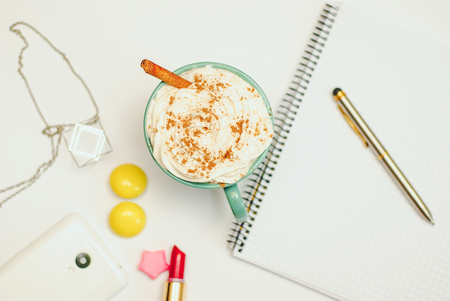 Blank empty notebook page with pen and spice latte . Spring summer flat lay with accessoriesの写真素材